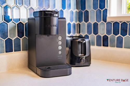 a coffee maker sitting on a counter next to a toaster at Wanderlust Hideaway, Venture Base Unit 1 in Kanab