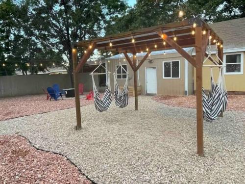 a swing set in a backyard with lights at Explorer's Haven, Venture Base Unit 5 in Kanab