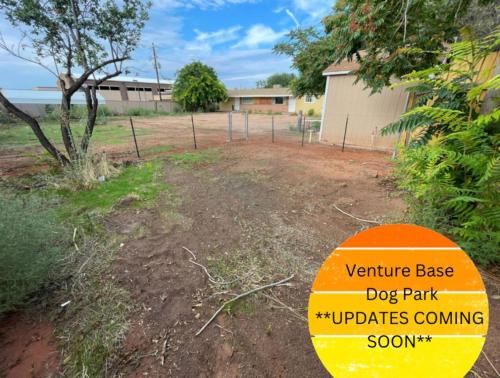 a dog park with an orange sign in a yard at Lake House Escape, Venture Base Unit 7 in Kanab