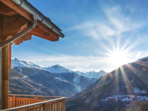 a view of the mountains from a balcony of a house at Chalet Falcons Nest in Hérémence