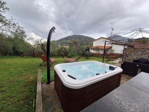 a jacuzzi tub on a patio in a yard at Villa San Pietro in Portovenere