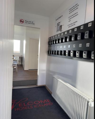 a hallway with a room with a display of cell phones at Starlight Camping Pods in Hvolsvöllur