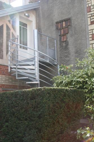 a metal railing on the side of a building at Les Hauts du Plateau in Châtillon