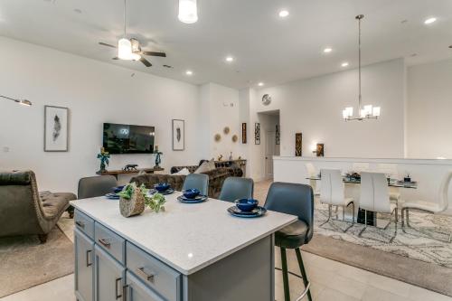 a kitchen and living room with a table and chairs at Home away from home in Lewisville