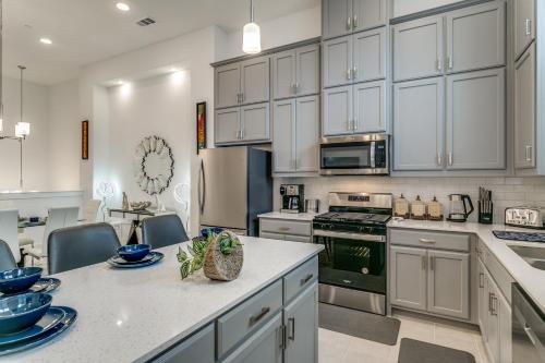 a kitchen with white cabinets and a counter top at Home away from home in Lewisville