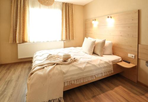 Llit o llits en una habitació de Nida Inn Self Check-in