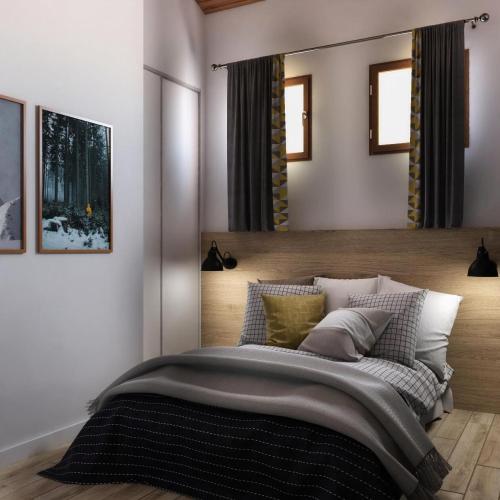 une chambre avec un grand lit avec une tête de lit en bois dans l'établissement Résidence Les Constellations - maeva Home - Appartement 2 pièces 6 personnes - Prestige MAE-9440, à La Plagne Tarentaise