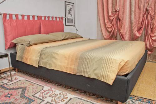 Ein Bett oder Betten in einem Zimmer der Unterkunft Oasi urbana, servizi e aree verdi a portata di mano