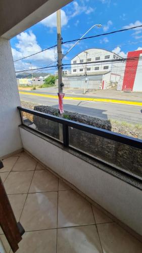 a view of a street from a train window at Hotel e Pousada Ed1000son in São João del Rei