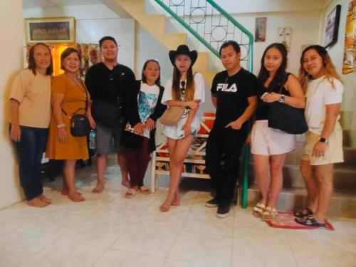 a group of people posing for a picture in a store at 15pax-U2-Rose&Fer Vigan Transient-Near Calle Crisologo in Bantay