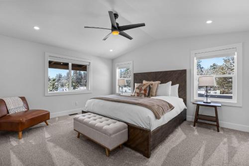 a bedroom with a bed and a ceiling fan at OBRILEY in Bend