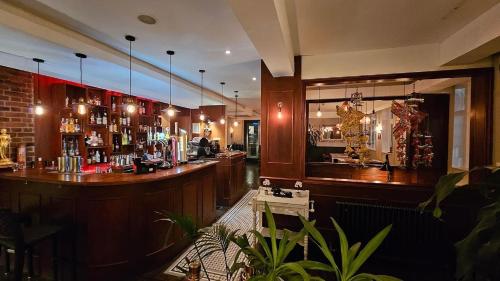 a bar in a restaurant with a bar counter at Thames Ditton Surrey in Thames Ditton