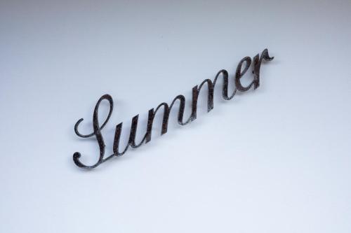 a sign that says summer on a white background at Villa 4 Seasons in São Roque do Pico