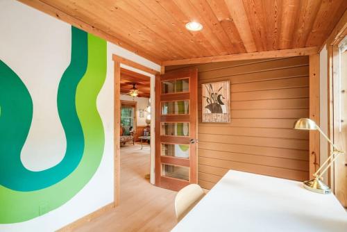 a home office with a green and wooden ceiling at 118 - The Willow Tree Bungalow in Fall City