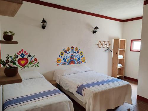 - une chambre avec 2 lits dans l'établissement Mia Bonita Hotel Boutique, à Tararameo