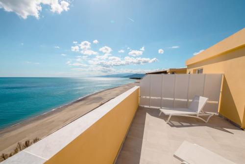 a balcony with a view of the ocean at BLU MARINE in Catanzaro