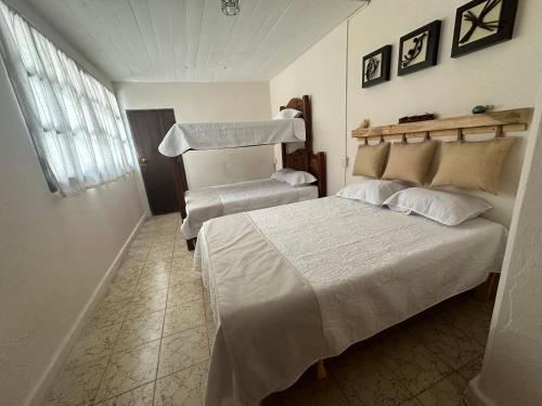 En eller flere senger på et rom på Chunca casa hostal
