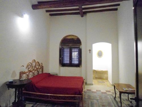 Een bed of bedden in een kamer bij Residence Marsala Antica