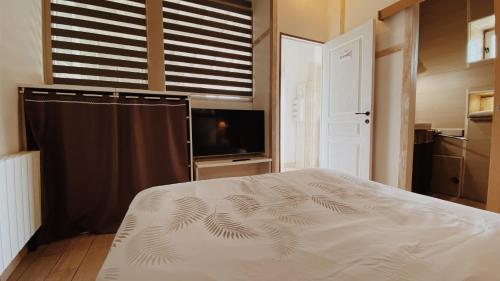 Postel nebo postele na pokoji v ubytování Domaine de Saint Florent - Piscine & Spa