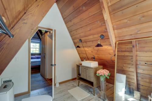 a bathroom with wooden walls and a wooden ceiling at Pocono Getaway A frame Cabin w/ Hot Tub Sauna in East Stroudsburg
