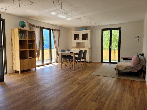 a large living room with a table and chairs at 3.5-Zimmer FeWo Primeli Fieschertal in Fieschertal