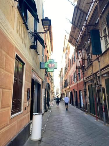an alley with people walking down a street at Villa Smeralda - Luxury on the Italian Riviera in Lavagna