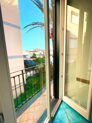 a sliding glass door with a view of a balcony at Putechella's Apartments in Maiori