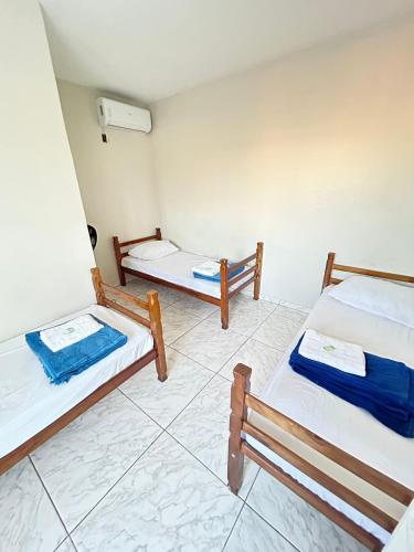 Ένα ή περισσότερα κρεβάτια σε δωμάτιο στο Pousada Quartos vcp