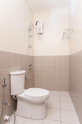a bathroom with a toilet and a shower at Riveli Retreat Mathiveri in Mathiveri
