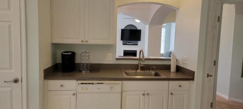 a kitchen with a sink and a microwave at Legacy Villa 805 in Gulfport