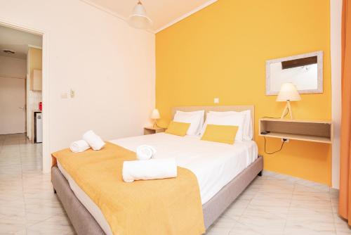 a hotel room with a bed and a tv at City Life Marina apartment No. 2 in Ampavris