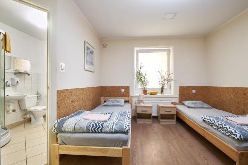 Katil atau katil-katil dalam bilik di Apartamenty P7 Dzierżoniów