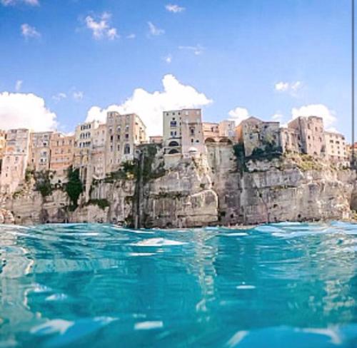 a view of a city from a body of water at Tropea Holiday House in Tropea