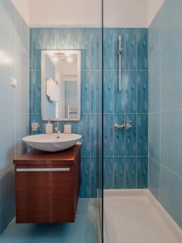 a bathroom with a sink and a shower at Villa Corfu Horizon in Kato Korakiana