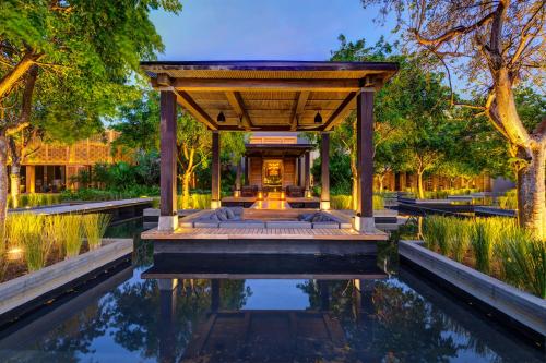 a pavilion with a pond in a garden at NIZUC Resort & Spa in Cancún