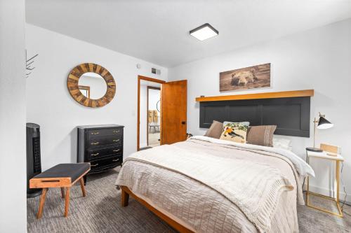 a bedroom with a bed and a mirror at Sunnyside Retreat - Tahoe City, 4 BR, Pet Friendly, Bonus Room in Tahoe City