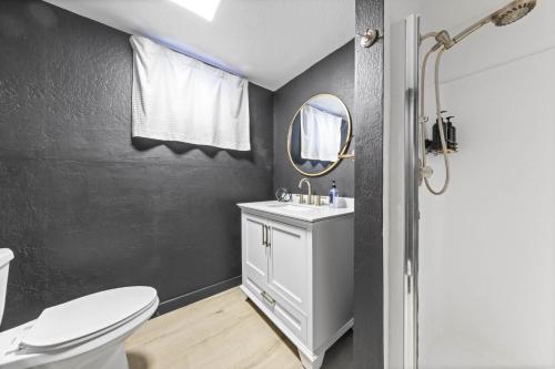 a bathroom with a white toilet and a mirror at Sunnyside Retreat - Tahoe City, 4 BR, Pet Friendly, Bonus Room in Tahoe City