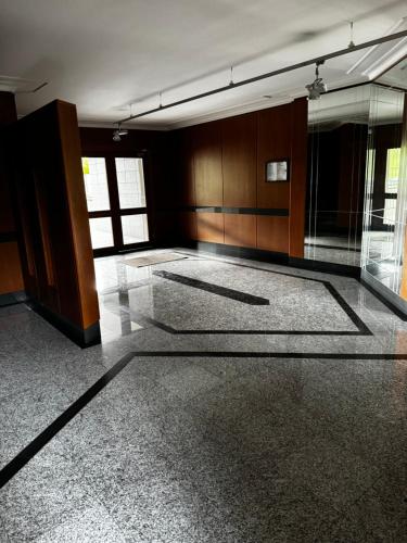 a large empty room with a glass floor at DolceVita Eur Torrino Prestige in Rome