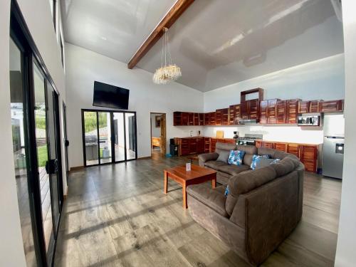 a living room with a couch and a table at Canavida Villas & Resort in Uvita