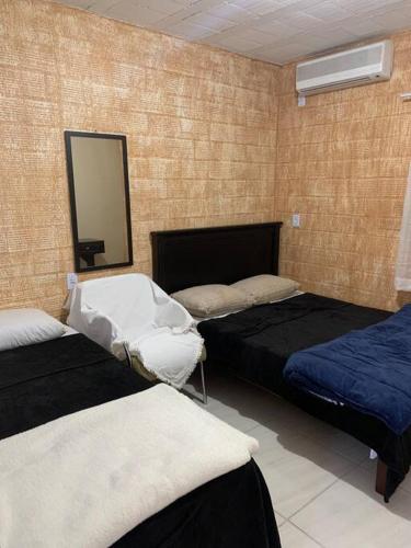 A bed or beds in a room at Apartamento em Gramado 2
