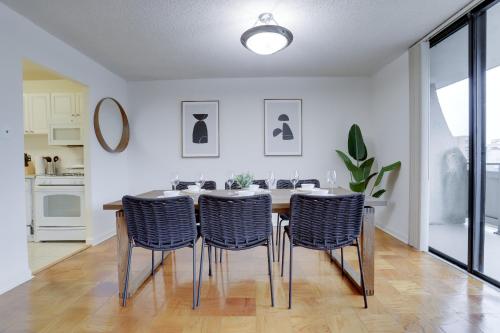 a dining room with a table and four chairs at Spacious & Comfortable Condo at Crystal City in Arlington