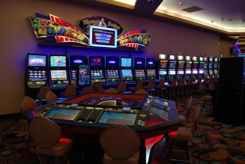 a casino with a bunch of slot machines at Ramada by Wyndham Princess Paramaribo in Paramaribo