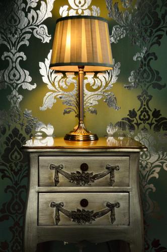 a lamp on top of a dresser in a room at The Hotel Commodore in Llandrindod Wells