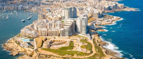 an aerial view of a city next to the ocean at Sliema Luxury Apartments - Wish Malta in Sliema