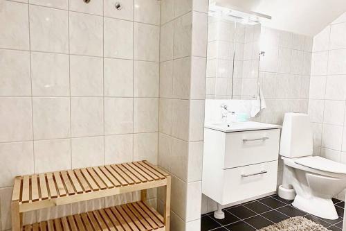 a bathroom with a toilet and a sink at Penthouse nära Liseberg - Mässan - Avenyn in Gothenburg