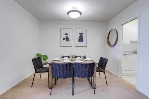 a dining room with a table and chairs at Incredible 1 BR Apt + Den @Crystal City With Gym in Arlington