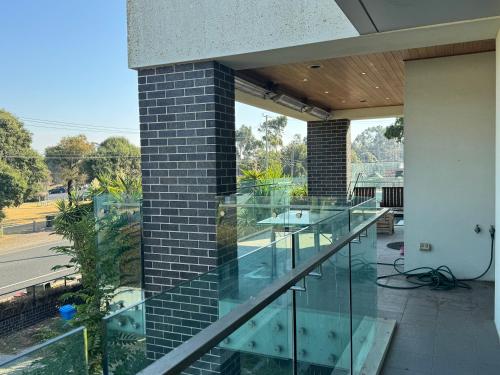an image of a glass balcony of a house at Geelong Beach Q House in North Shore