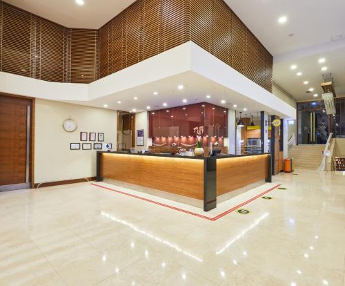 a lobby of a hotel with a reception counter at Dedeman Istanbul in Istanbul