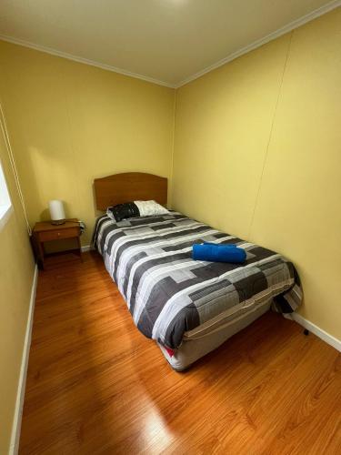 Un pat sau paturi într-o cameră la Cabaña Duquesa