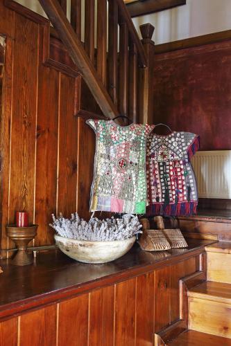 a bowl on a shelf with a pillow and a staircase at Nisanyan Hotel in Selcuk